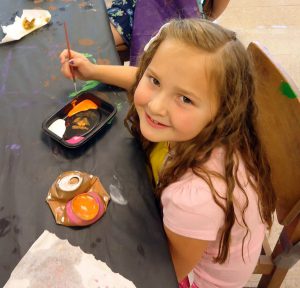 A youngster works on her project at last year’s Kemper Kids Summer Art Camp.