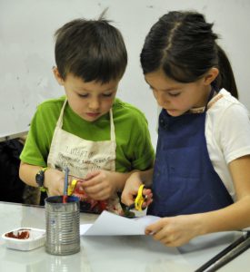 Reiland and Marley Mayfield work on a project.