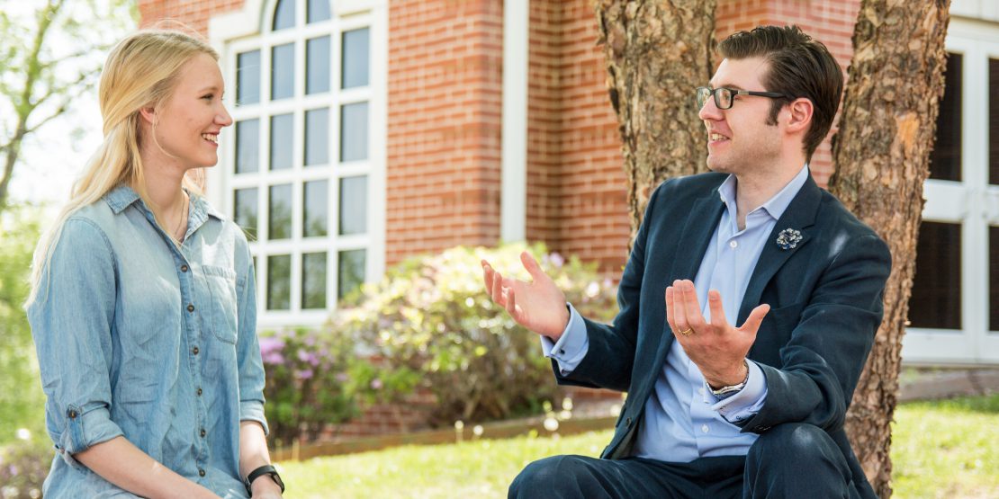 Professor Craig Bruce Smith talks with student Anna Blecha