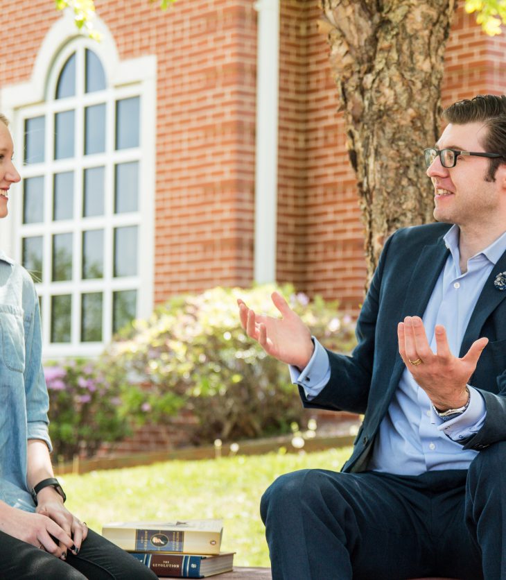 Professor Craig Bruce Smith talks with student Anna Blecha