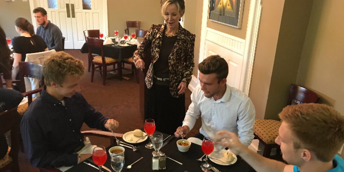 Dr. Jahnae Barnett with Students at Etiquette Dinner