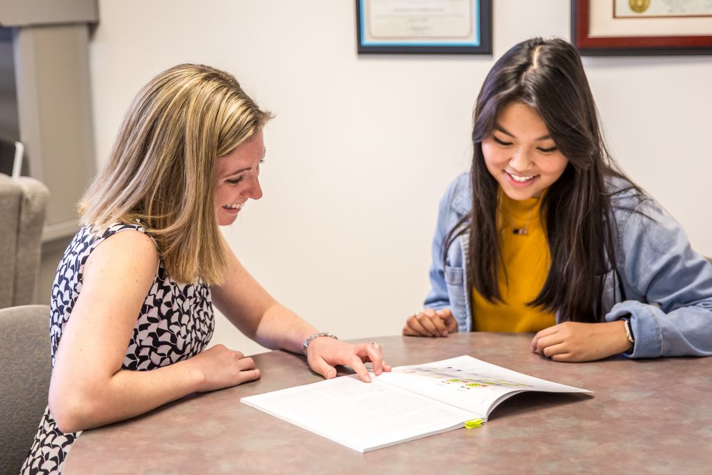 A student and a professor working together