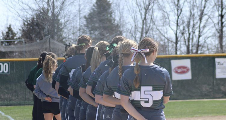 Softball team posed in a line