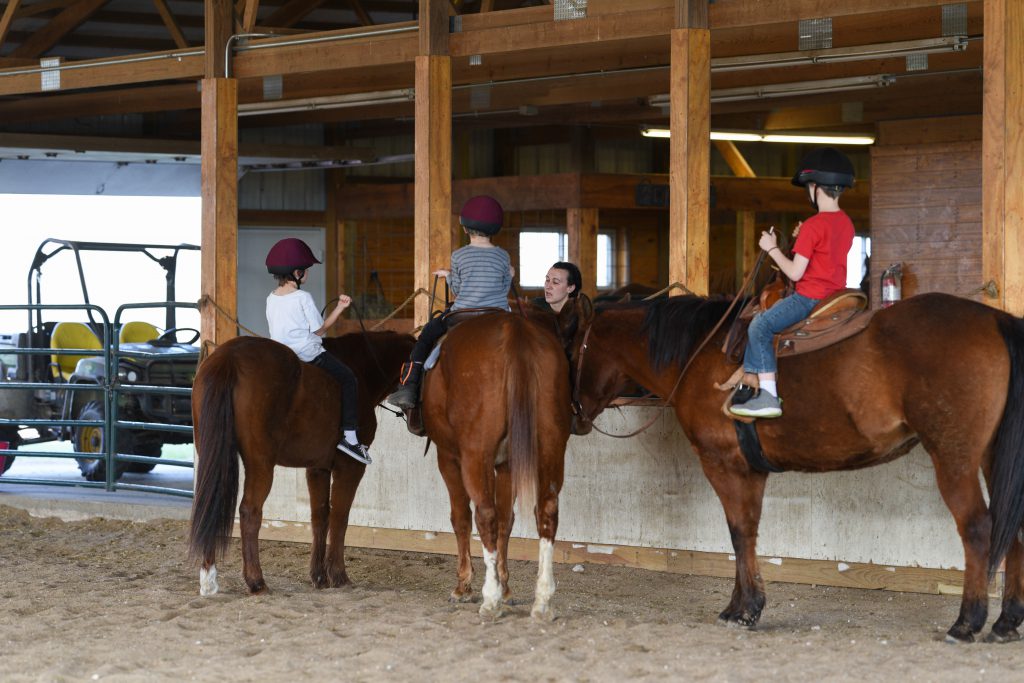 Three students learning from Rebecca Buchholz