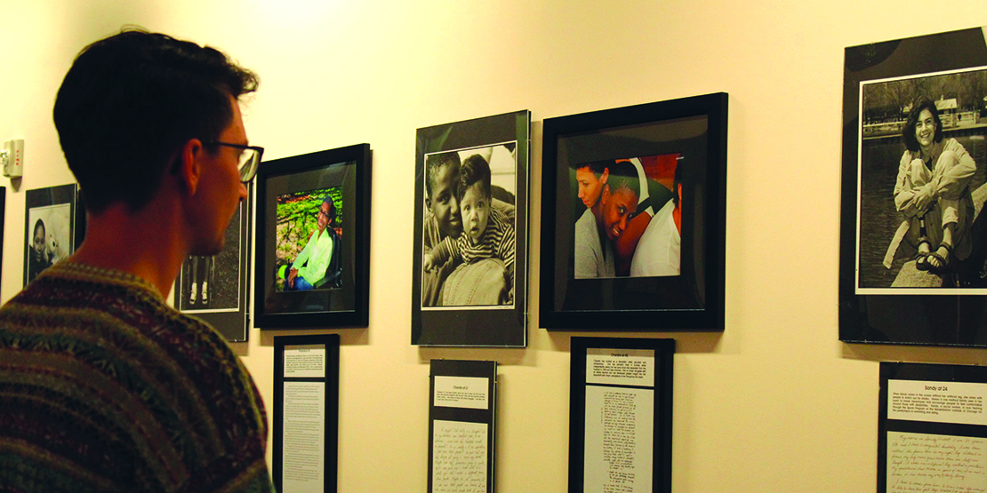 Male observing art in gallery