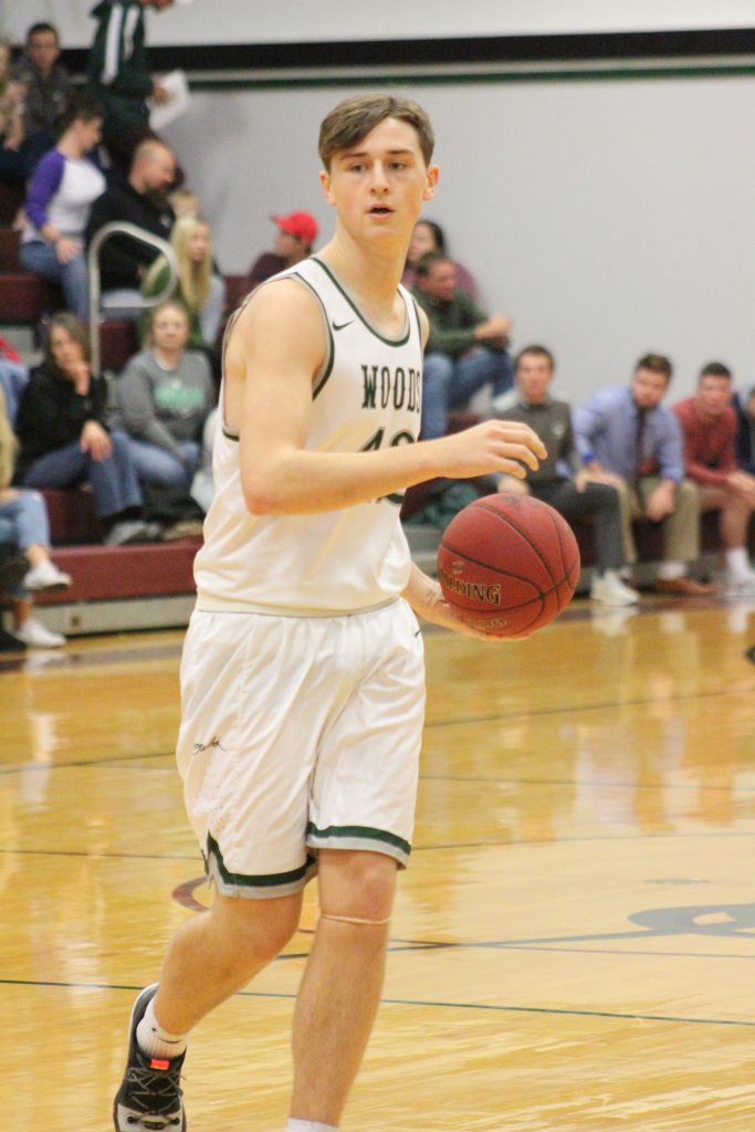 Makenzie with the basketball in a game