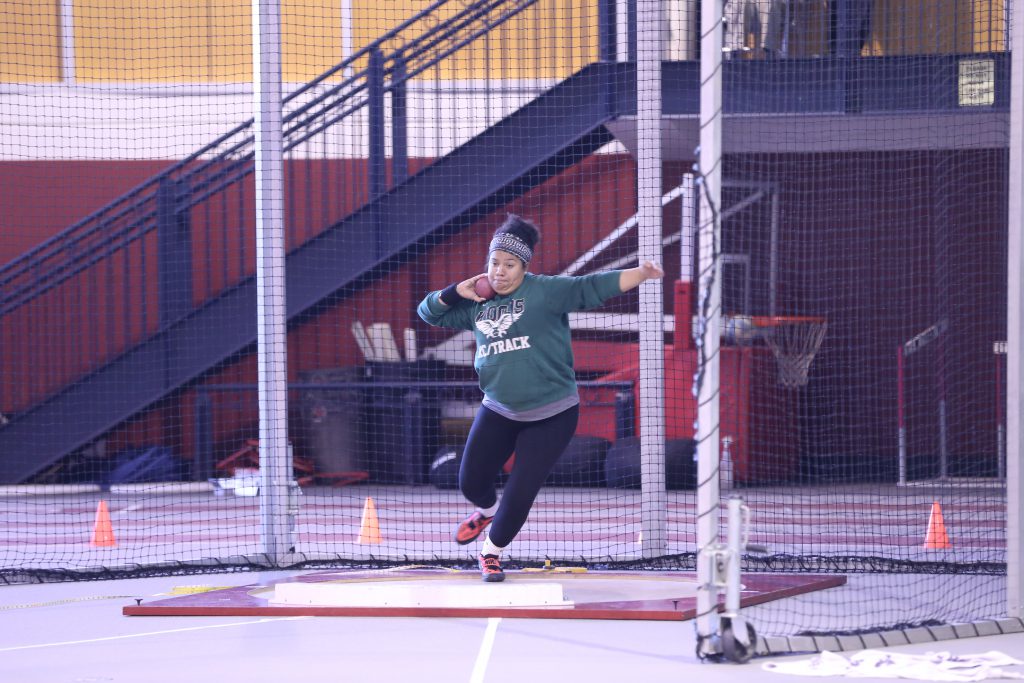 Ananiah in the middle of a shot-put throw