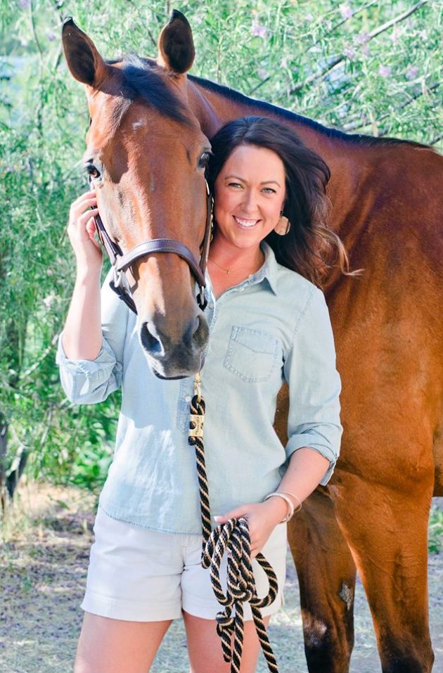 Ashley Stannard posing with a horse