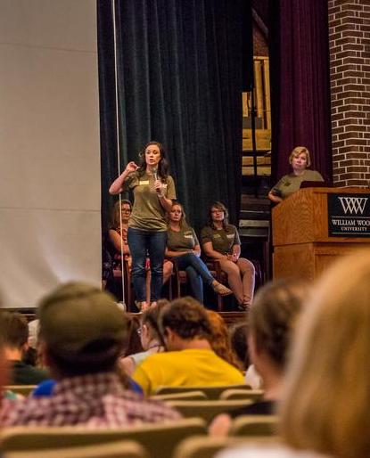 Katie speaking to an audience about the Academic Success Center