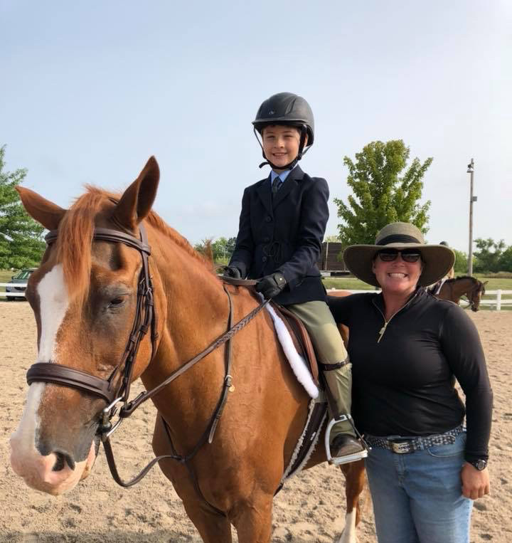 Picture of Patti and a student on her horse