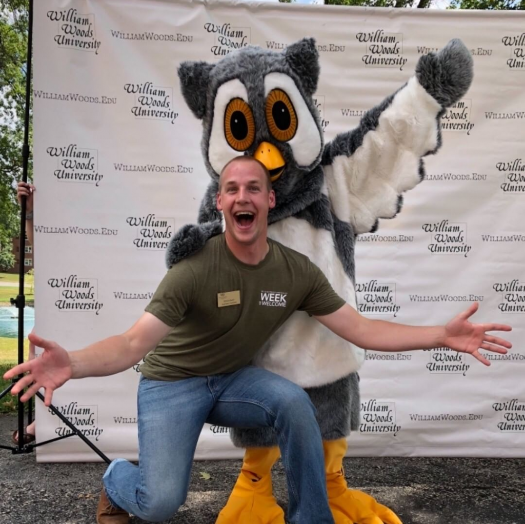 Image of Spencer buck with Screech the mascot