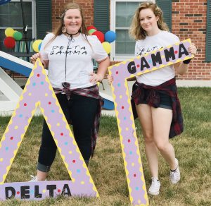 Shannon holding the "Gamma" in "Delta Gamma" with a sorority sister