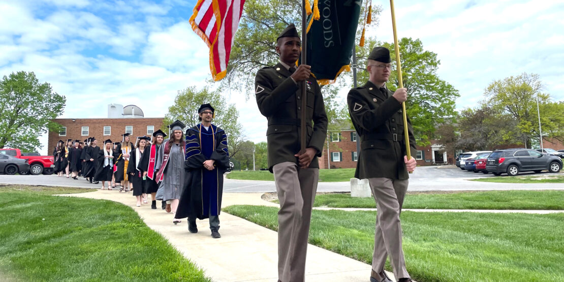 The line of graduates of William Woods University proceeds to the Cutlip Auditorium.