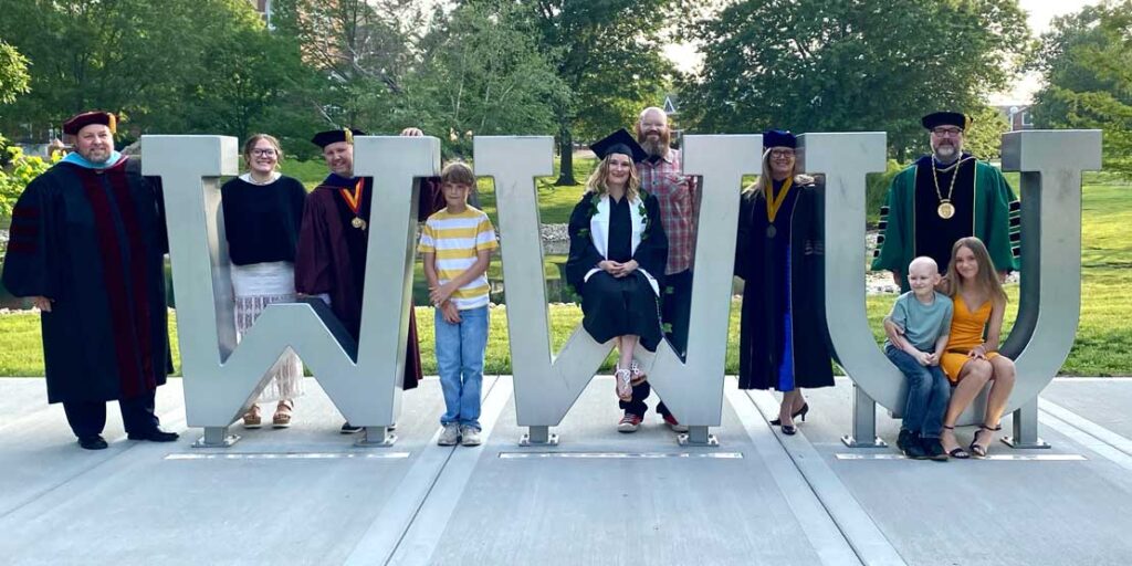 group in front of WWU letters