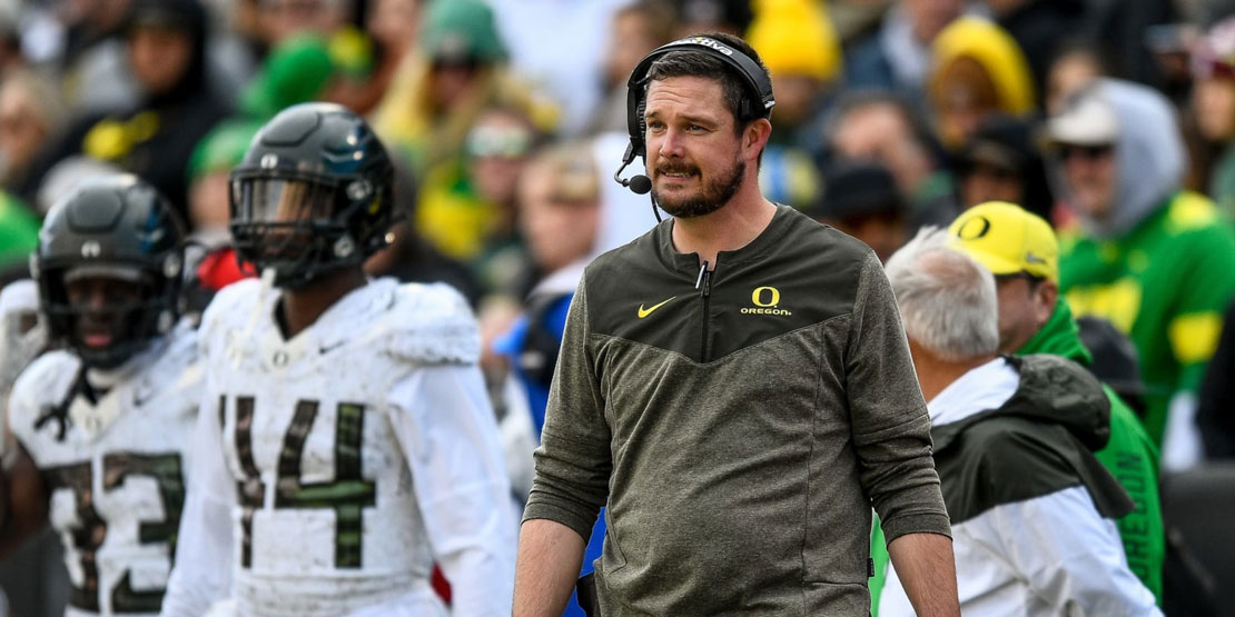 Coach Dan Lanning on the sidelines of Oregon football game.