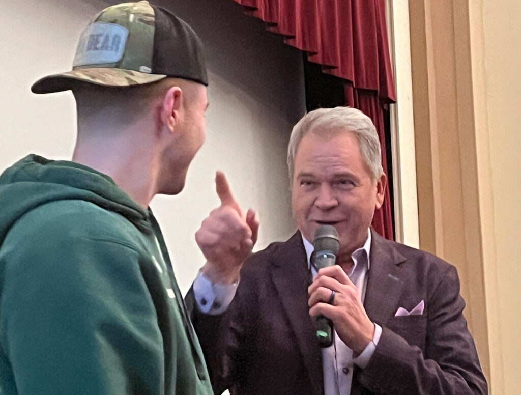 Rick Horton speaking to student on William Woods University Campus