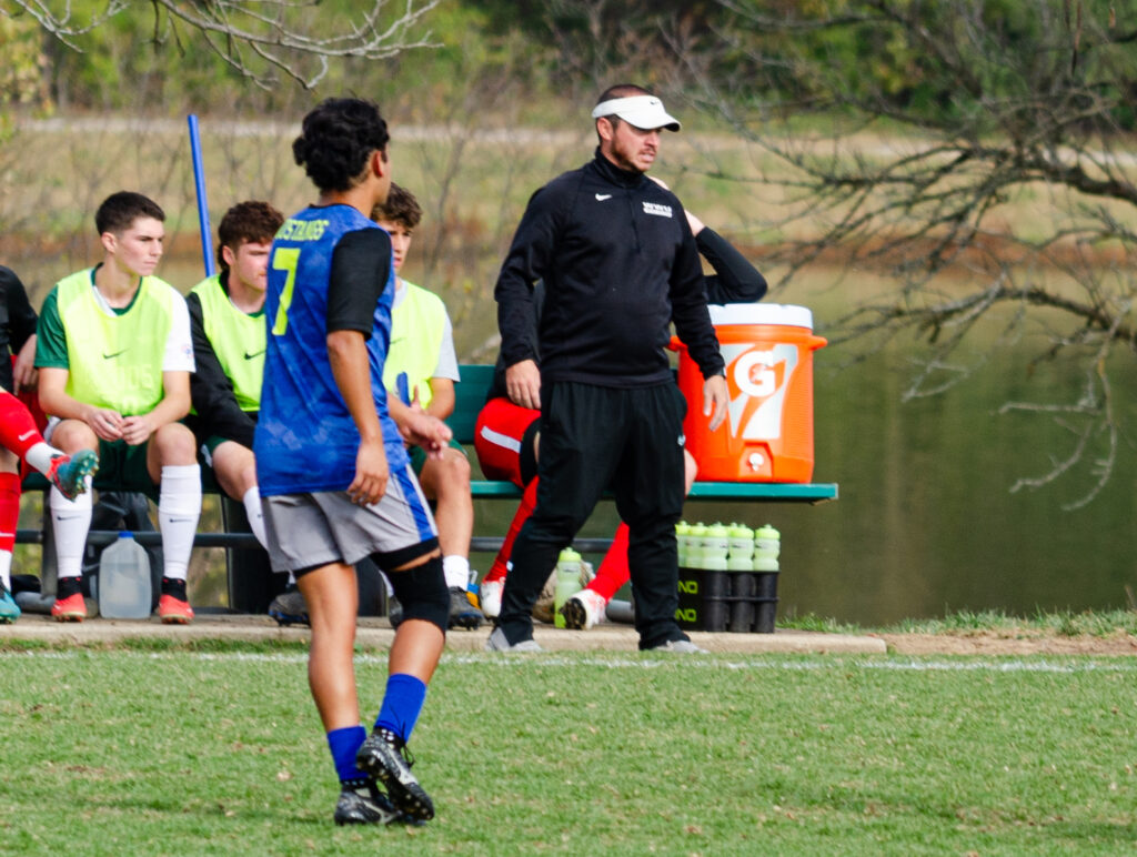 Tommy Nienhaus coaching at a Men's soccer game