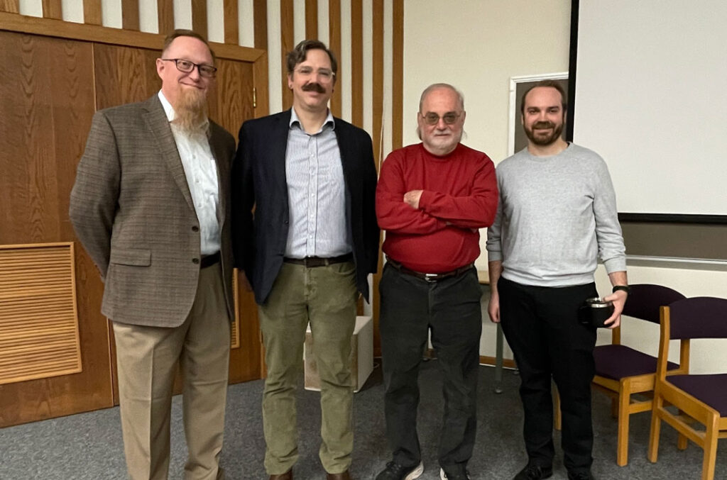 Photographer Richard Orton standing next to the WWU employees that assisted with this event.