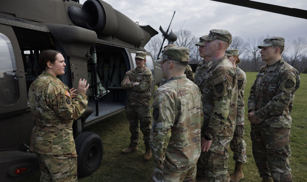 Show-Me GOLD students of William Woods University listen to the caption give instructions about the black hawk